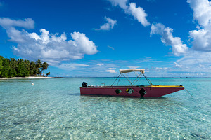 Colorful boat on the lagoon near Motu Pitiahe, Maupiti, French P, a Nature Photo by GoodGoods