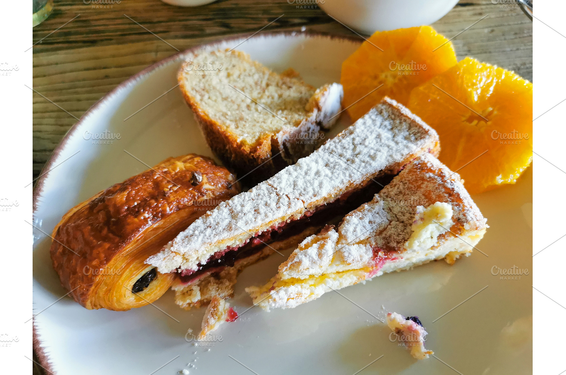 Assorted pastries, cakes, orange, a Food & Drink Photo by sceptical cactus