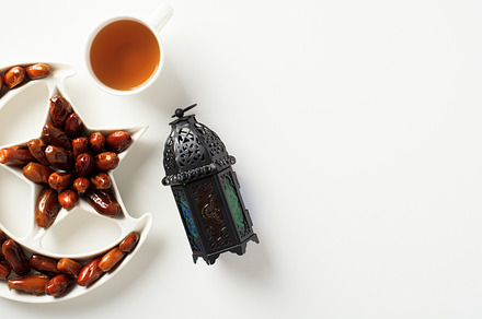 Ramadan Kareem background with Arabic lantern, dried dates in Islamic star and, a Holiday Photo by photoguns
