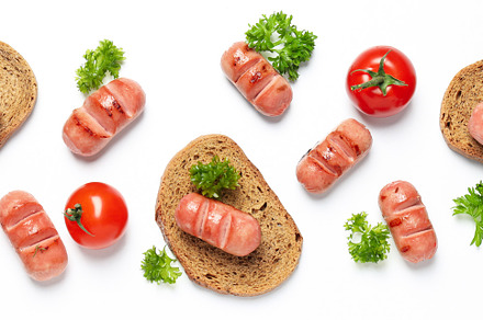 Concept of tasty food, grilled mini sausage, top view, a Background Photo by AtlasStudio