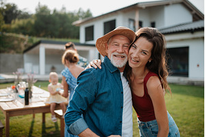 Senior father with daughter outdoors, a Person Photo by HalfPoint