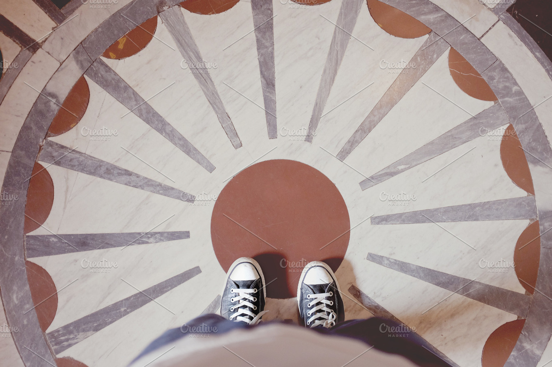 Standing on decorative pattern floor, a Person Photo by EnjoyLife