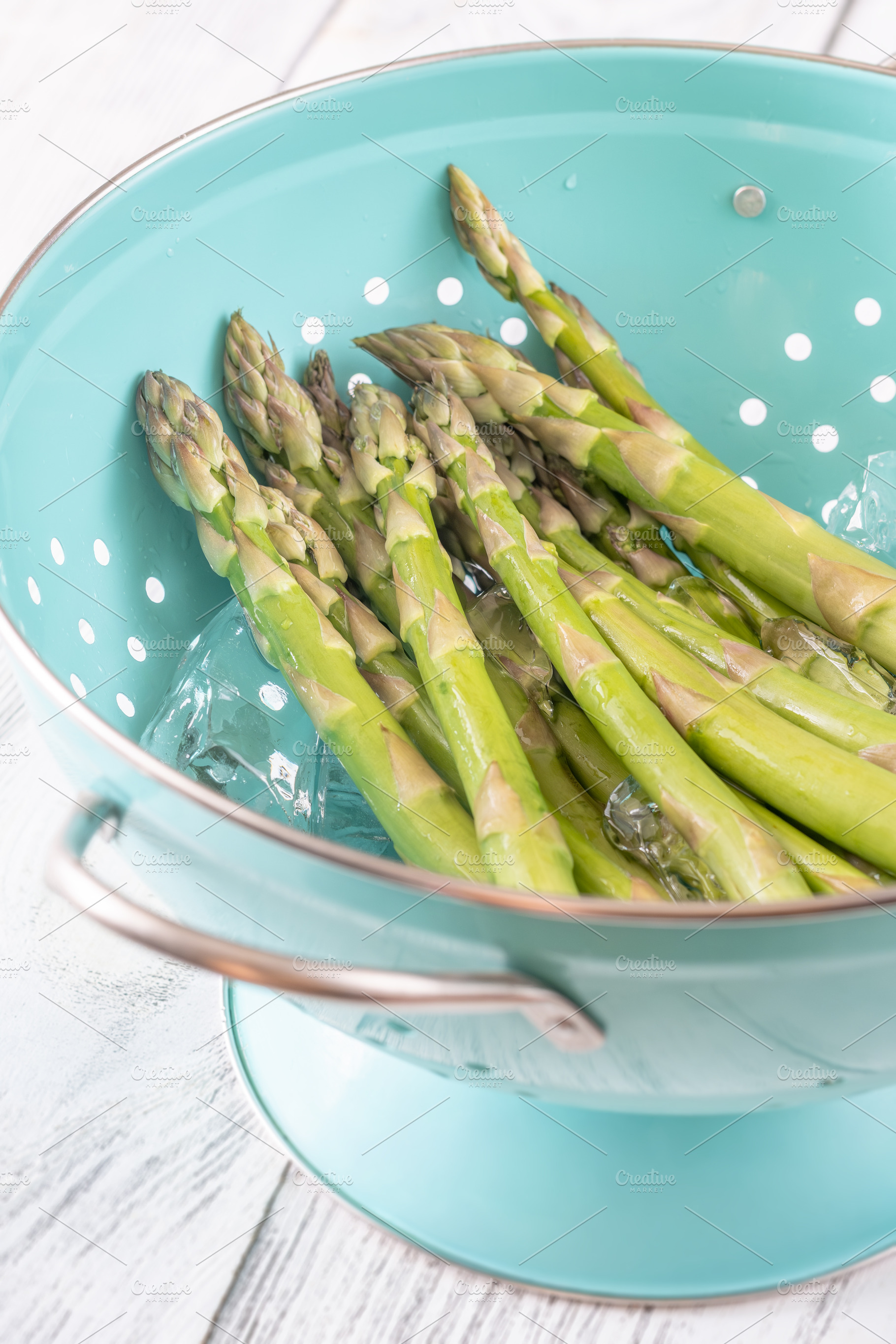 Fresh Green Asparagus Chilling In Ice Water During Blanching Pre, a Food & Drink Photo by Alexander Prokopenko