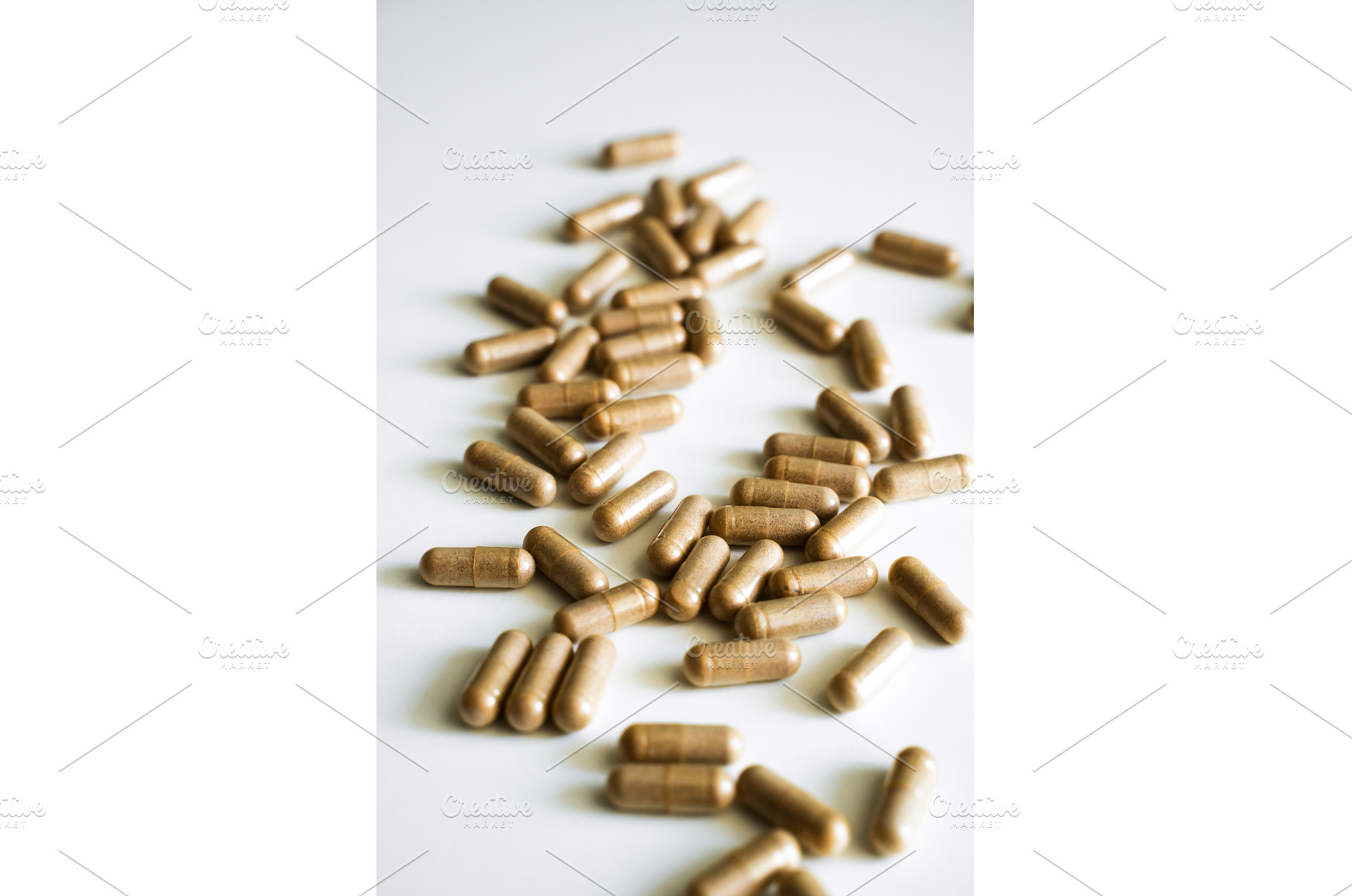 Brown herbal capsules scattered on, a Health & Medical Photo by volodymyrshtun13795