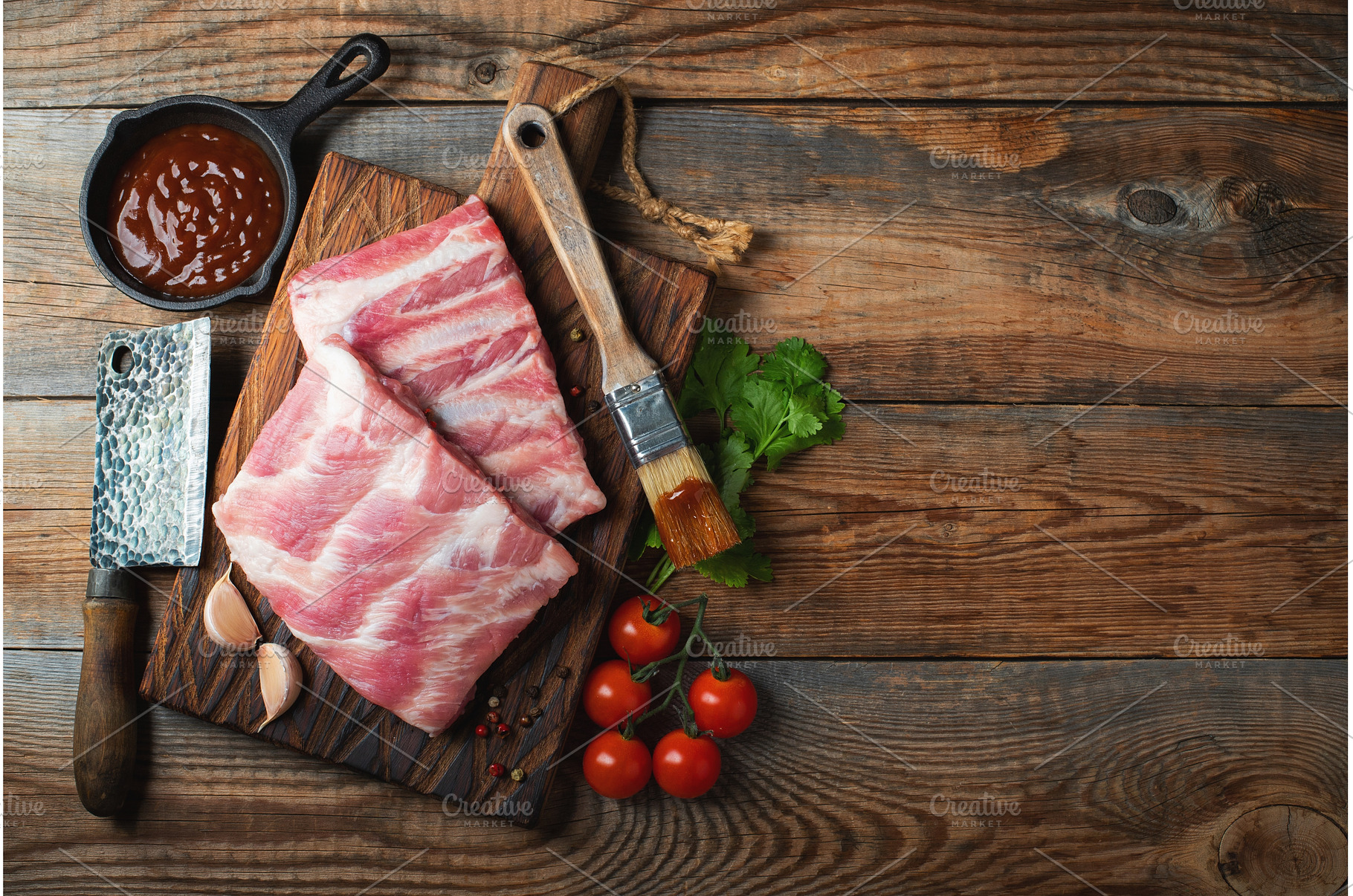 Raw pork ribs with spices, salt and, a Food & Drink Photo by Budarinphoto