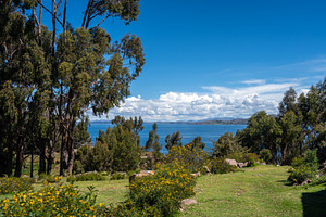 Lush green landscape overlooking Lake Titicaca from Llachon, Per, a Nature Photo by GoodGoods