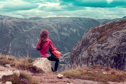 girl sitting on a stone and looking, a Person Photo by Eni_fly