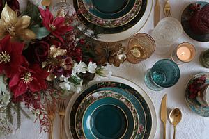 Christmas dinner table setting with elegant poinsettia centerpiece, festive dec, a Food & Drink Photo by Studio ANNA