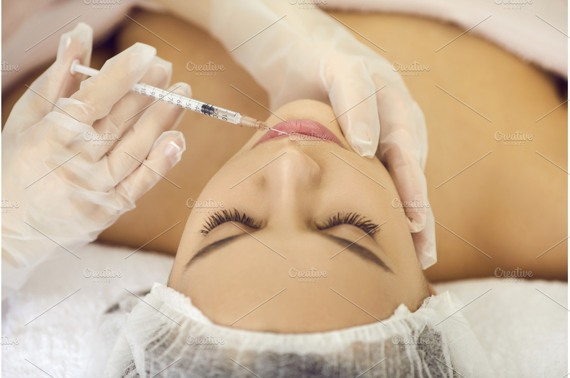 Young woman getting botox injection, a Health & Medical Photo by StudioRomantic