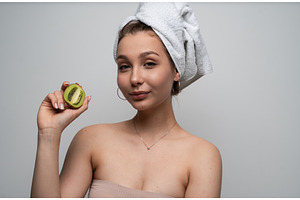 Woman with a towel on her head, a Health & Medical Photo by volodymyrshtun13795