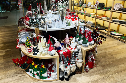 Festive display of seasonal decorations and items in a home decor store, a Photo by AS photostudio