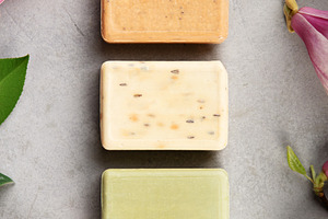 Natural Handmade Soap Bars with Flowers on Gray Background, a Health & Medical Photo by Natalia Klenova's Shop