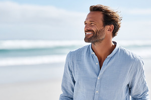 Smiling man in a light blue shirt, a Person Photo by MistyDay