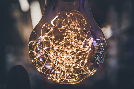 Giant light bulb with light garlands, an Abstract Photo by Visual Motiv