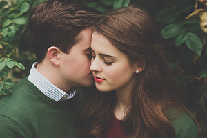 Young couple sharing an intimate moment, man expressing tenderne, a Person Photo by Studio ANNA
