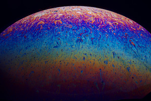 Abstract close-up of a vibrant soap bubble surface showing swirl, a Background Photo by Ales Munt