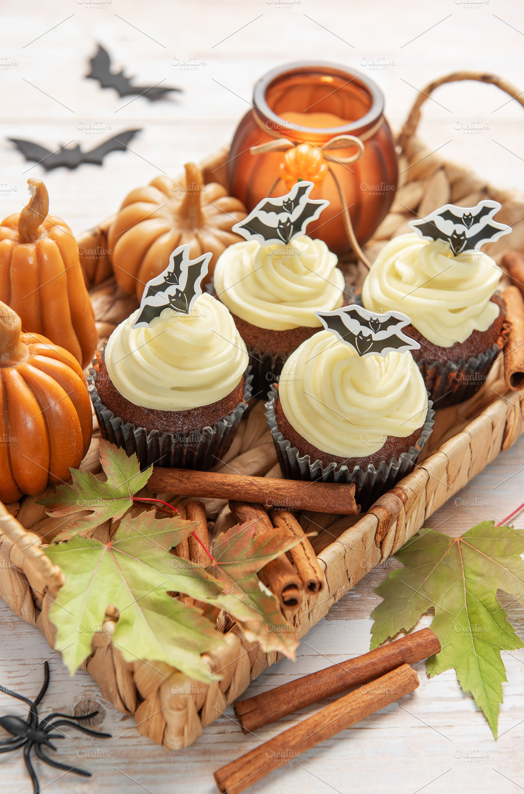 Halloween cupcakes with bat decoration and autumn elements, a Food & Drink Photo by Olena Rudo