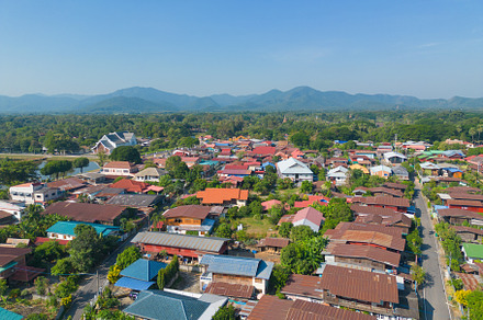 Aerial view of local residential neighborhood roofs. Urban housi