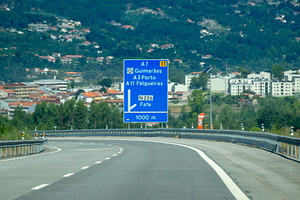 Highway exit to Portuguese cities with signage, an Architecture Photo by DanFLCreativo