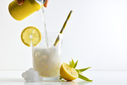 Refreshing lemon drink with ice on a white isolated background, a Food & Drink Photo by Davizro's Market (Thumbnail 1 of 2)