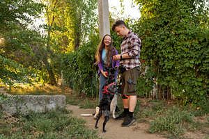 Father and daughter smiling with two, an Animal Photo by Elena Vagengeim