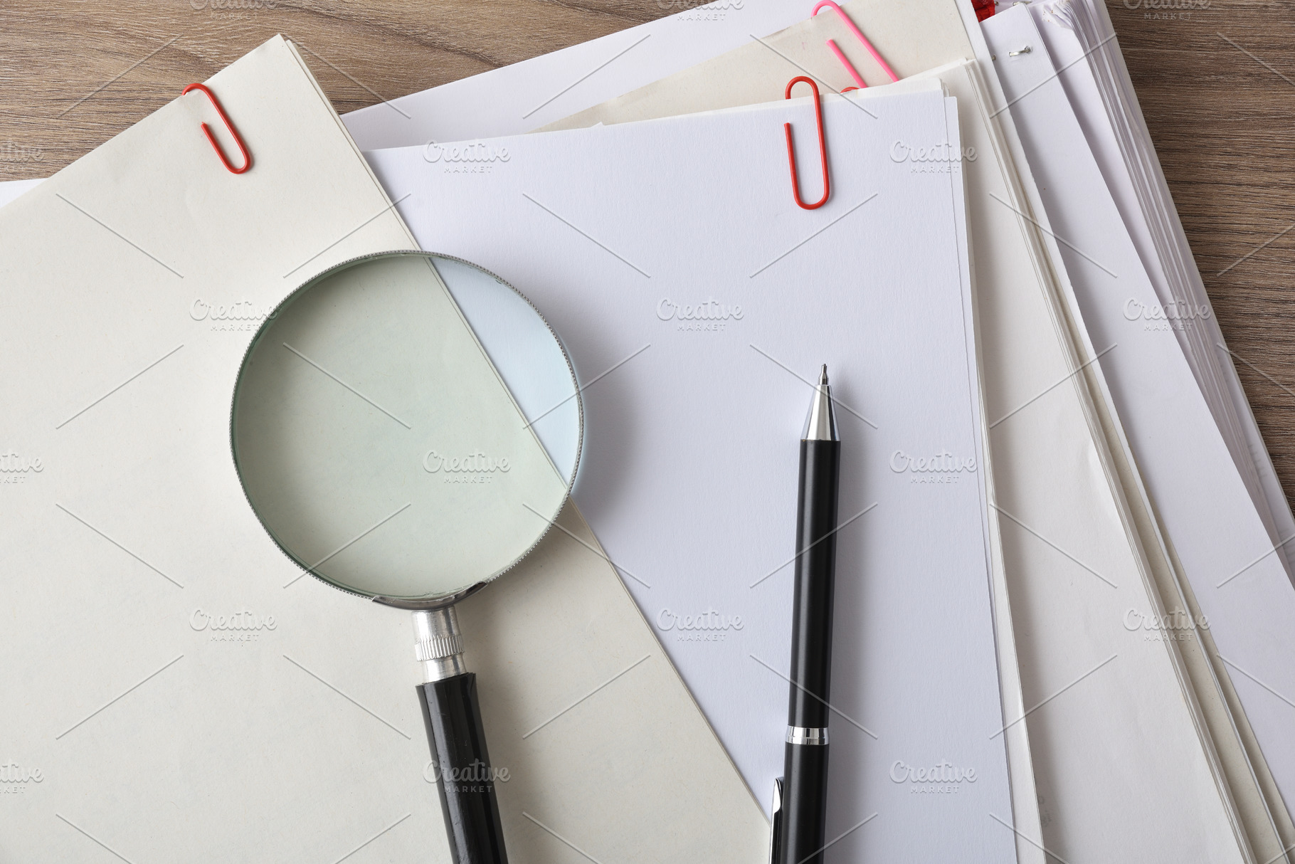 Magnifying Glass on Stacked Office Documents, a Business Photo by Davizro's Market
