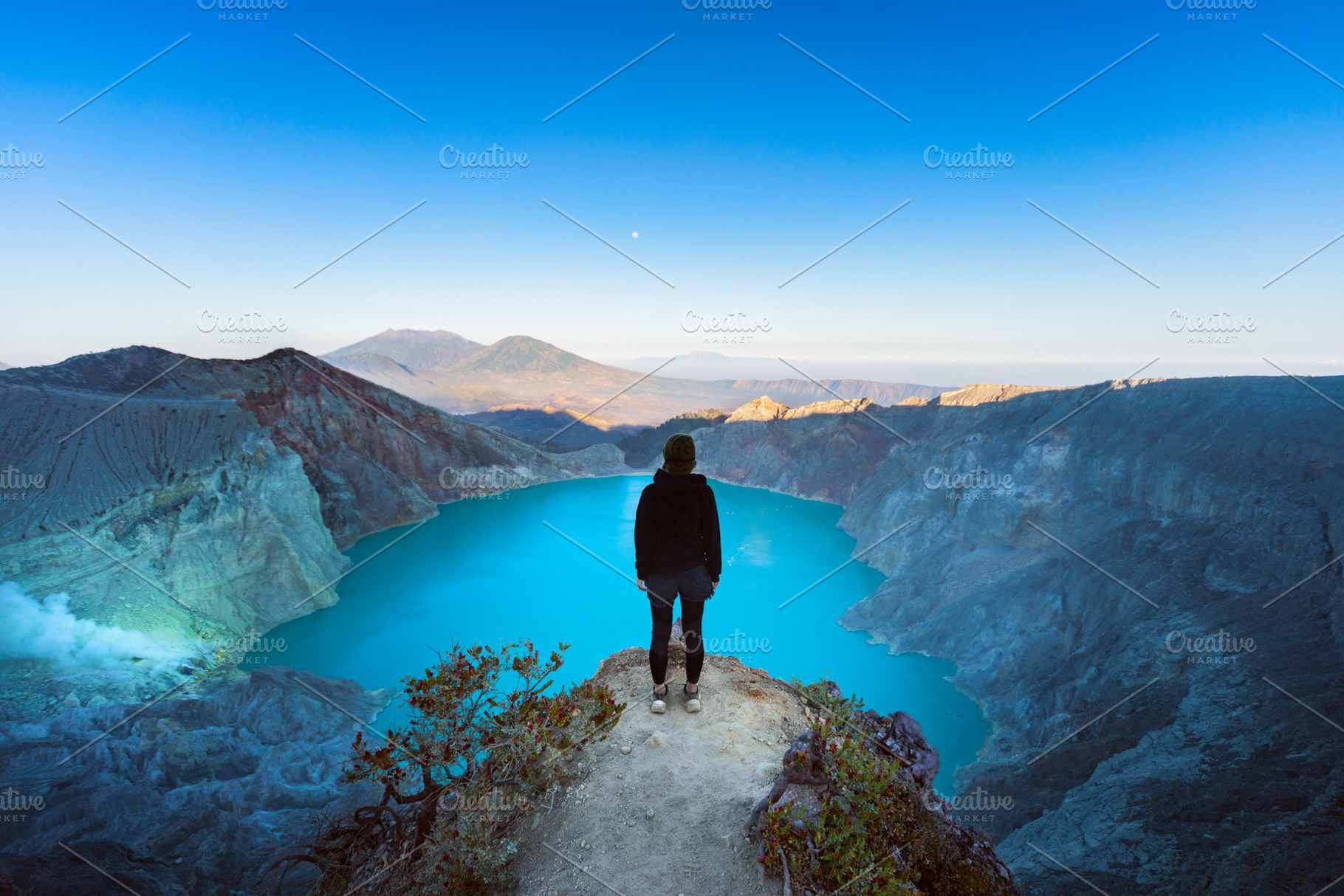 Sunrise at volcano lake Kawah Ijen, a Person Photo by Tropical Studio