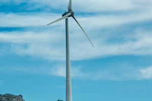Wind turbine under cloudy sky, an Industrial Photo by DanFLCreativo