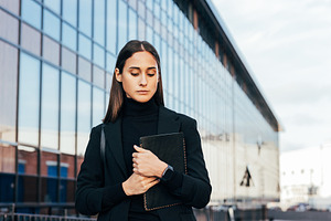 Confident businesswoman in black, a Business Photo by Artem Varnitsin