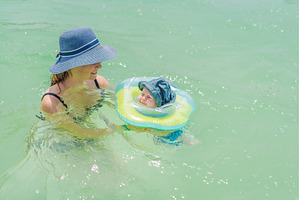 Baby floating in a neck ring in, a Person Photo by Elizaveta Galitskaya