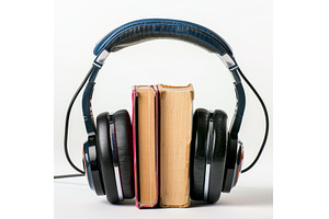 Headphones holding together two, a School & Education Photo by Ylivdesign