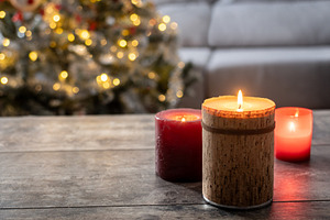 Red Christmas candles with holiday lights and christmas tree, a Food & Drink Photo by etorres69