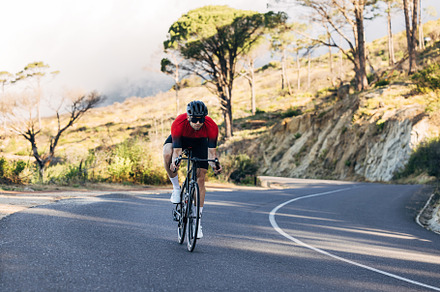 Male cyclist doing a ride on a road, a Sports & Recreation Photo by Artem Varnitsin