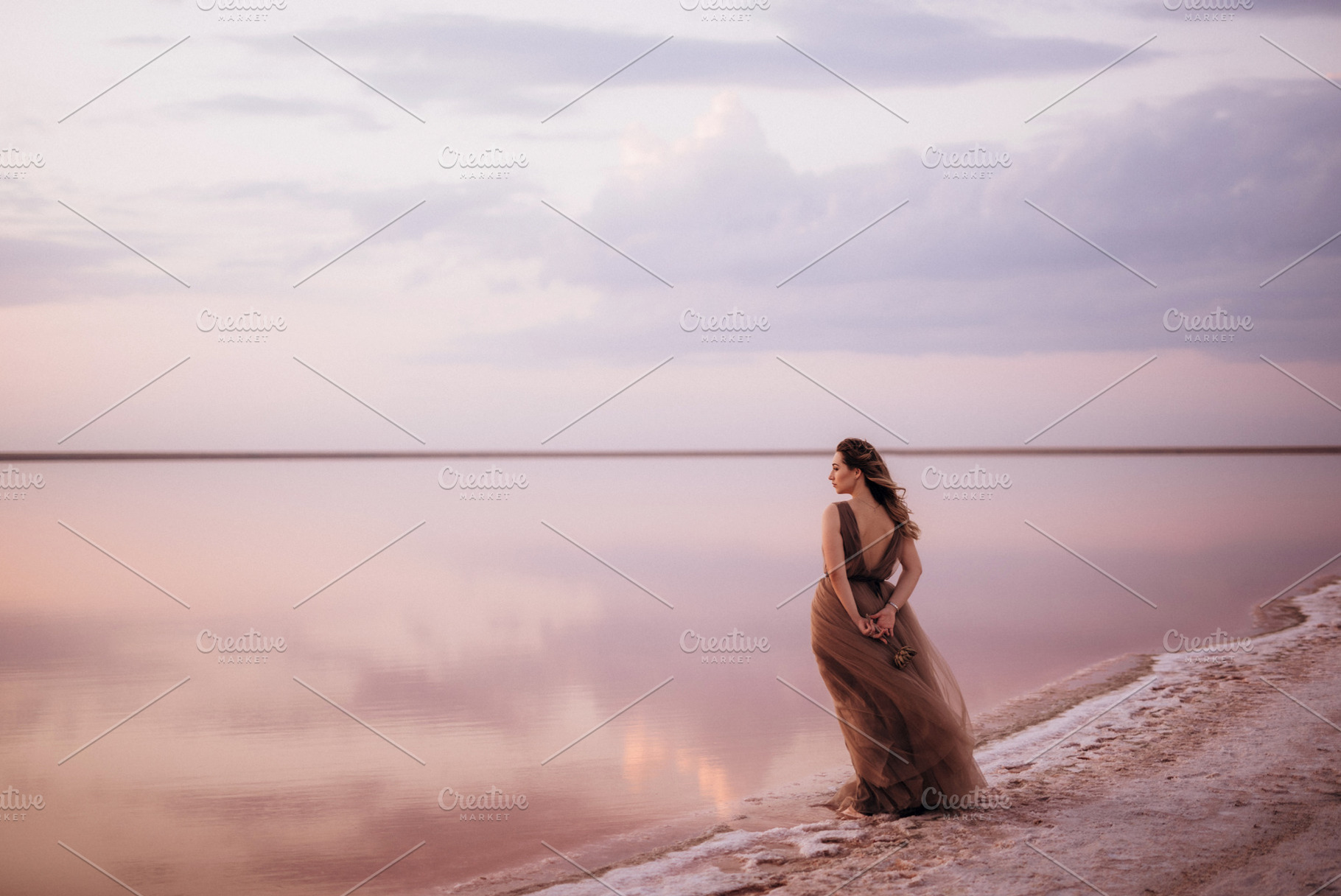 girl on the shore of a pink salt lake, a Person Photo by Weddings, People, Travel