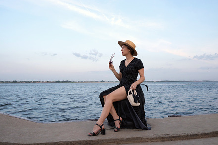 Woman in polka-dot dress gazes