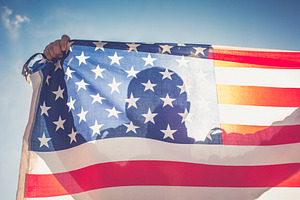 Man with american flag containing flag, american, and caucasian