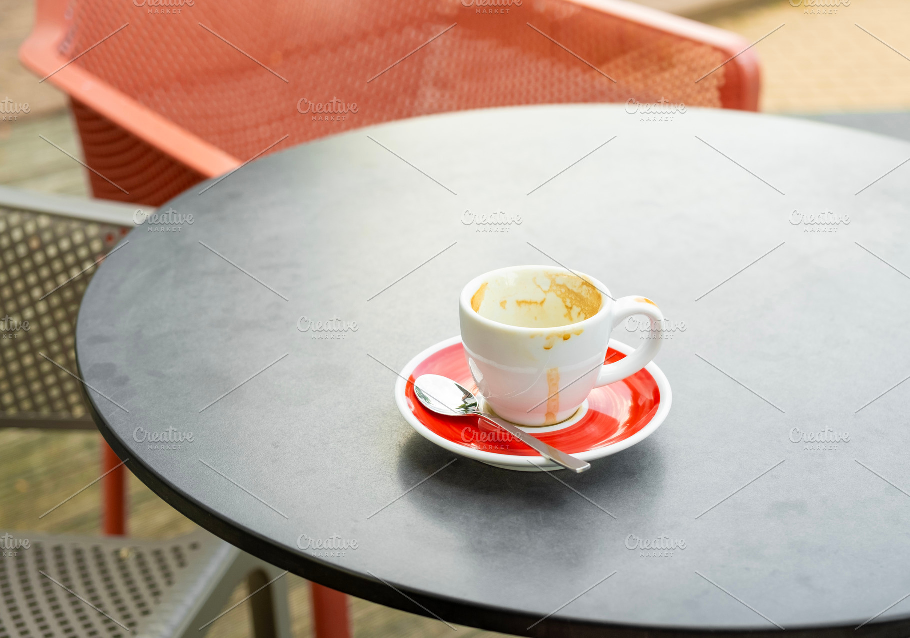 Empty coffee cup on a cafe table, a Food & Drink Photo by BOOCYS