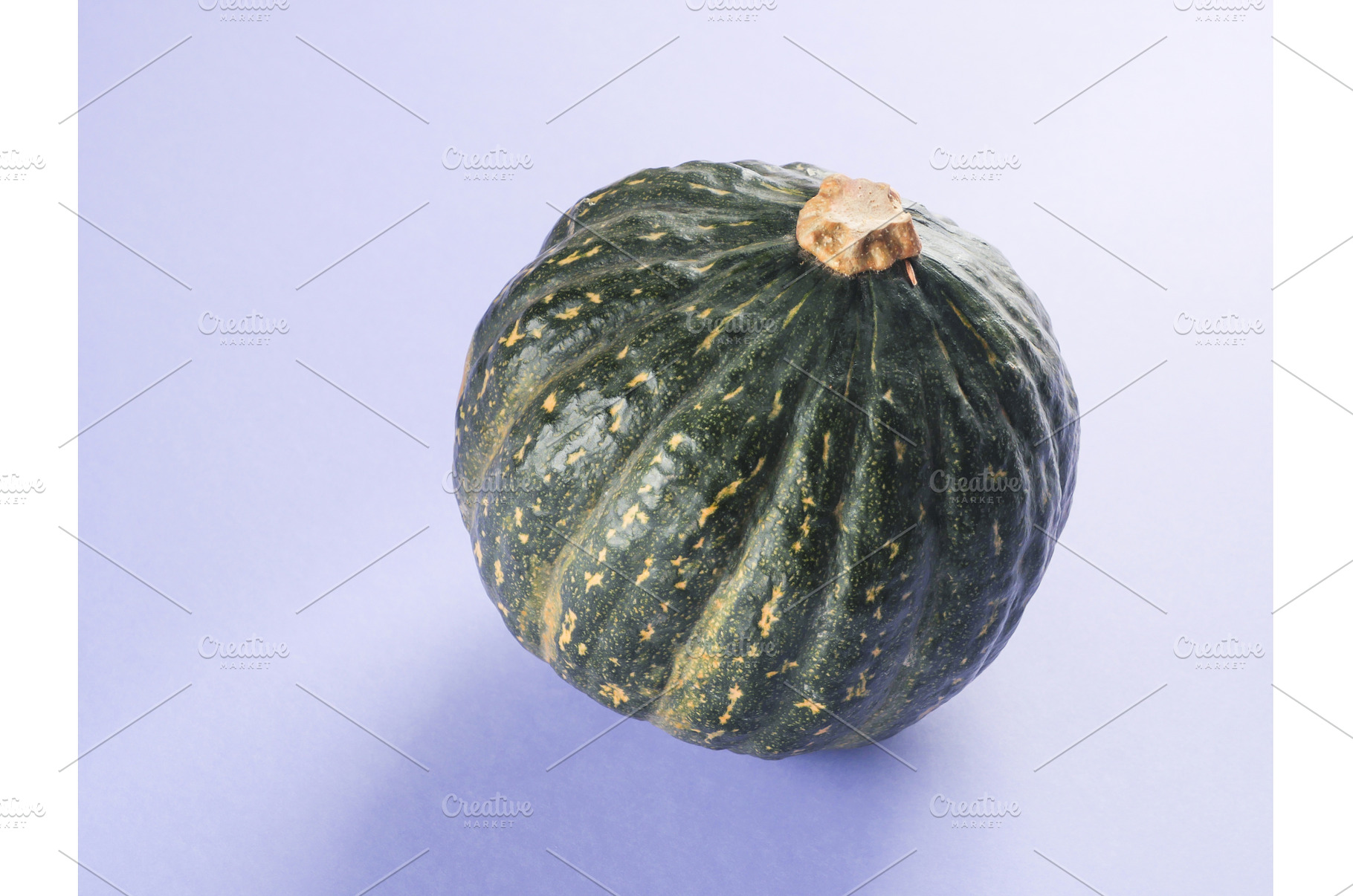 Green pumpkin on purple background, a Food & Drink Photo by Lifemorning