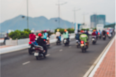 Blurred picture of motorcycles on, a Transportation Photo by Elizaveta Galitskaya