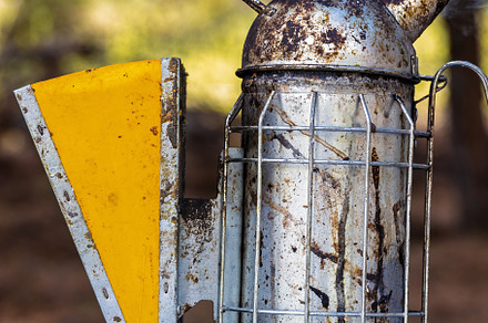 Rustic metal beekeeping smoker on a, an Industrial Photo by Perpis