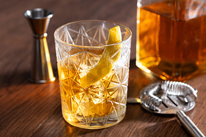 Rusty Nail Cocktail with Lemon Peel in Crystal Glass, a Food & Drink Photo by etorres69