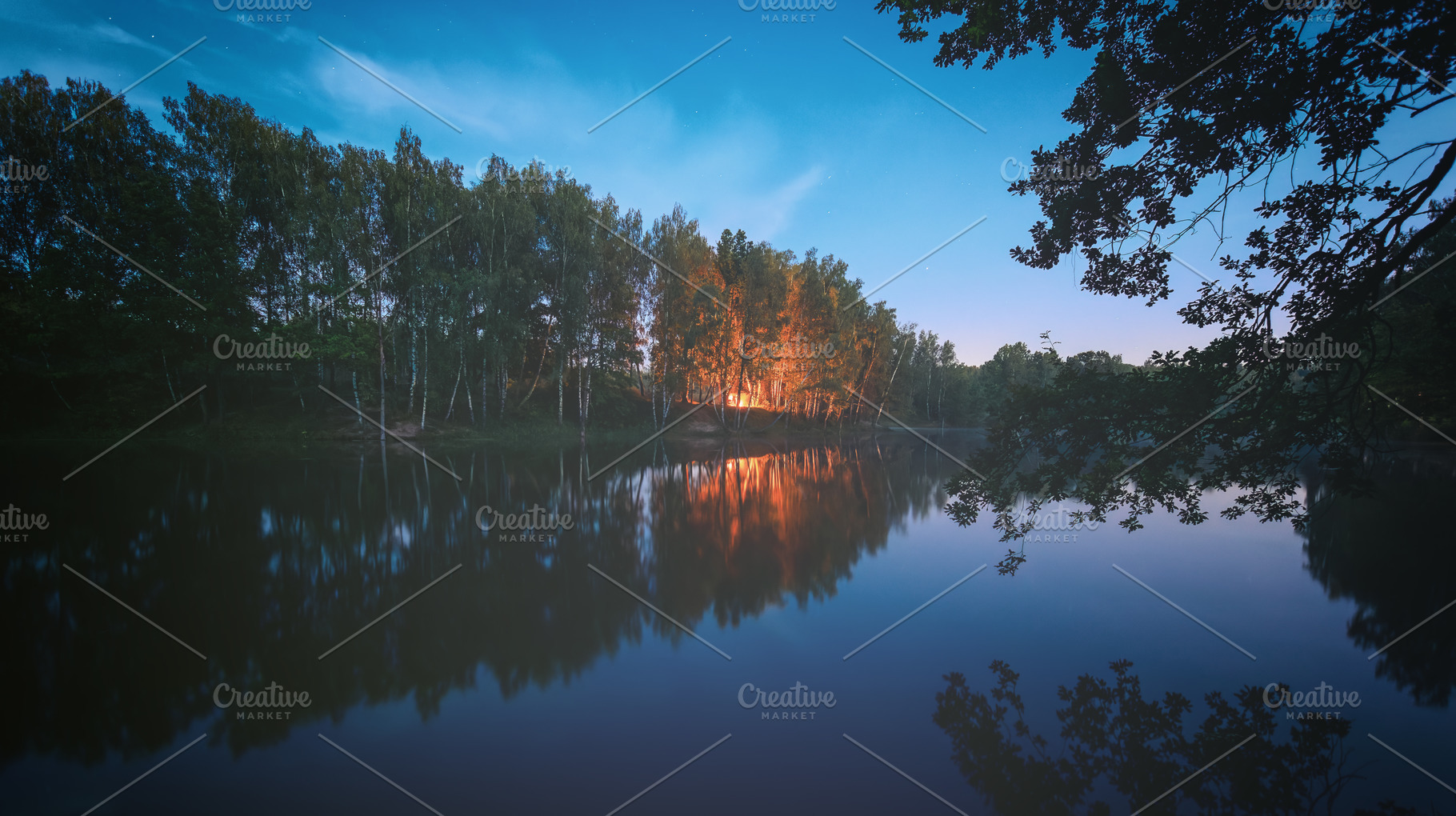 Night landscape with bonfire reflection on water surface, blue s, a Nature Photo by Eugene_Photo