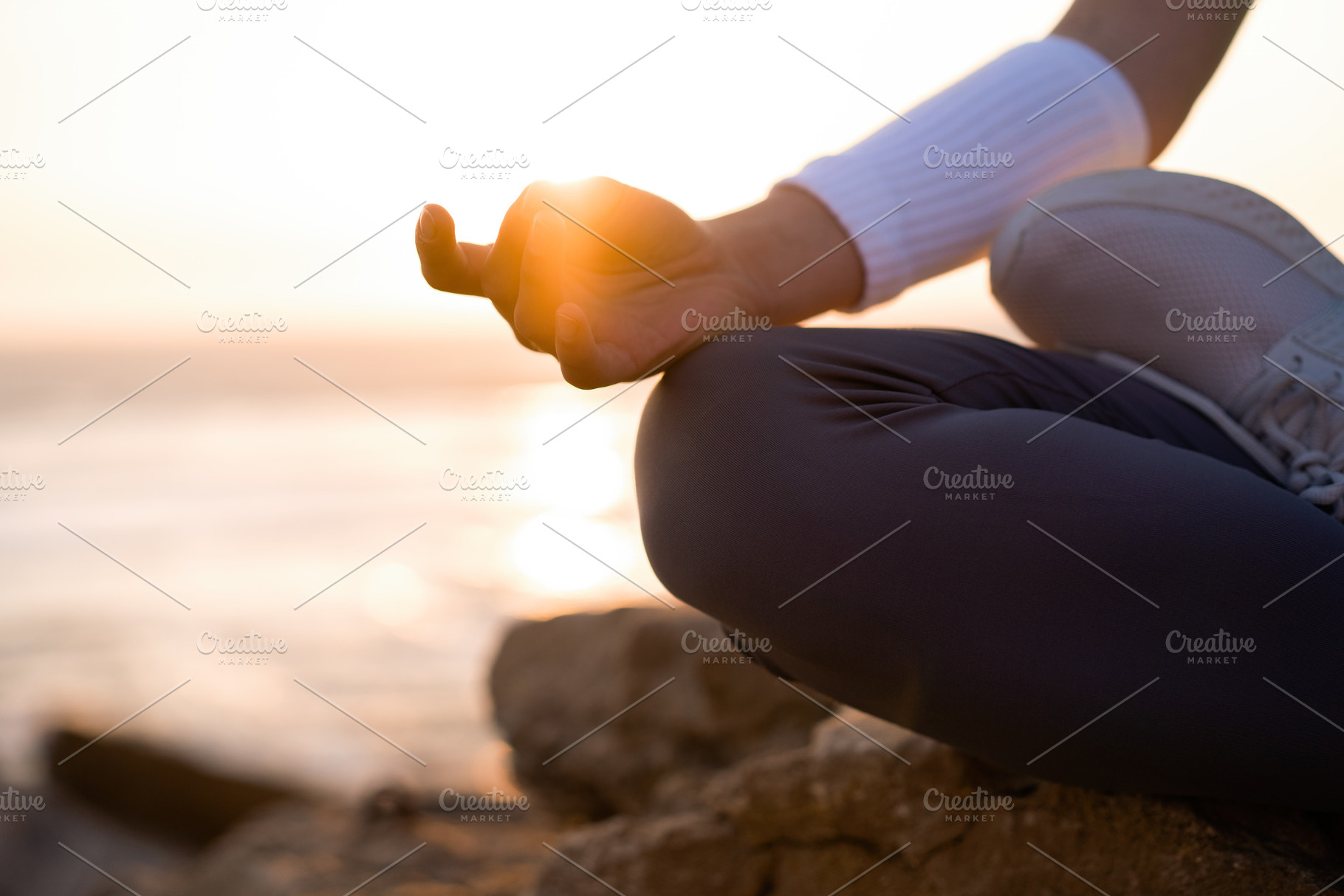 Woman practice yoga lotus pose to meditation with summer vacation rocky beach h, a Person Photo by andreonegin market