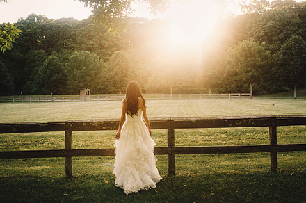 Beautiful bride watches the sunset, a Person Photo by IvashStudio
