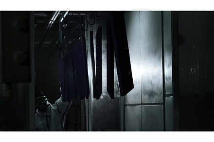 Worker at a factory moving a line of, an Industrial Photo by Media Whale Stock