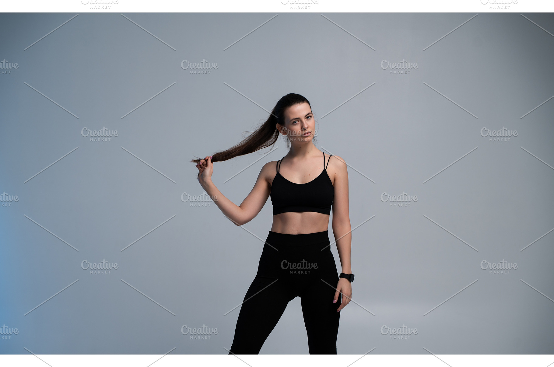 Young woman in black sportswear, a Sports & Recreation Photo by volodymyrshtun13795