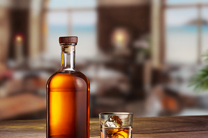 Glass of whiskey and whiskey bottle, a Food & Drink Photo by Volff