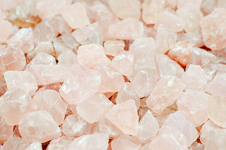 Rose quartz containing amethyst, crystals, and candle, a Nature Photo by Coral Antler