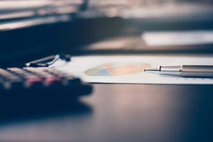 Close up of pen on business report featuring closeup, technology, and concept