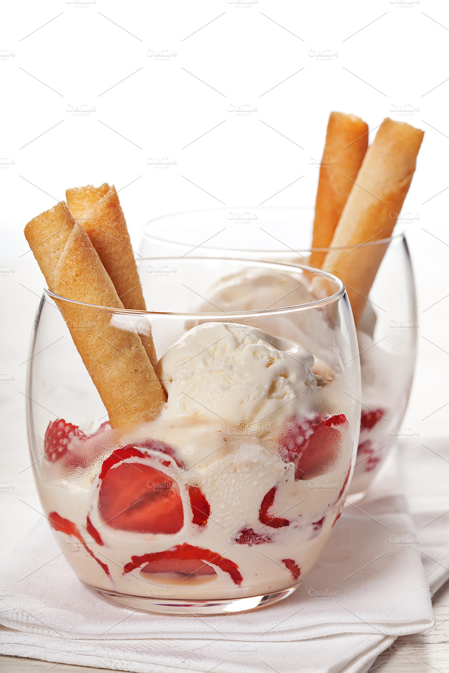 Vanilla Ice Cream With Strawberries In Glass Containing Closeup Cold And